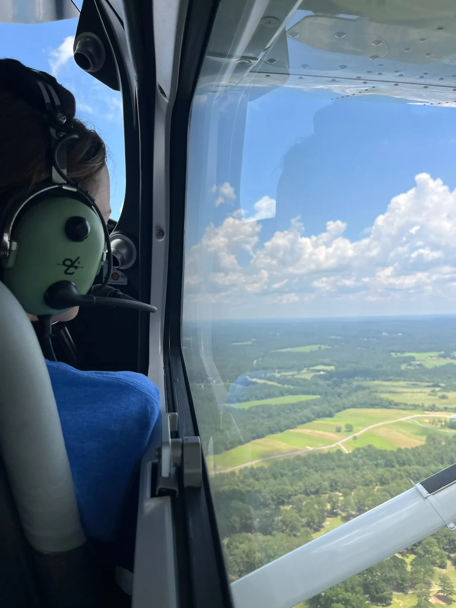 An ACE camper takes in the view from the cockpit on a discovery flight