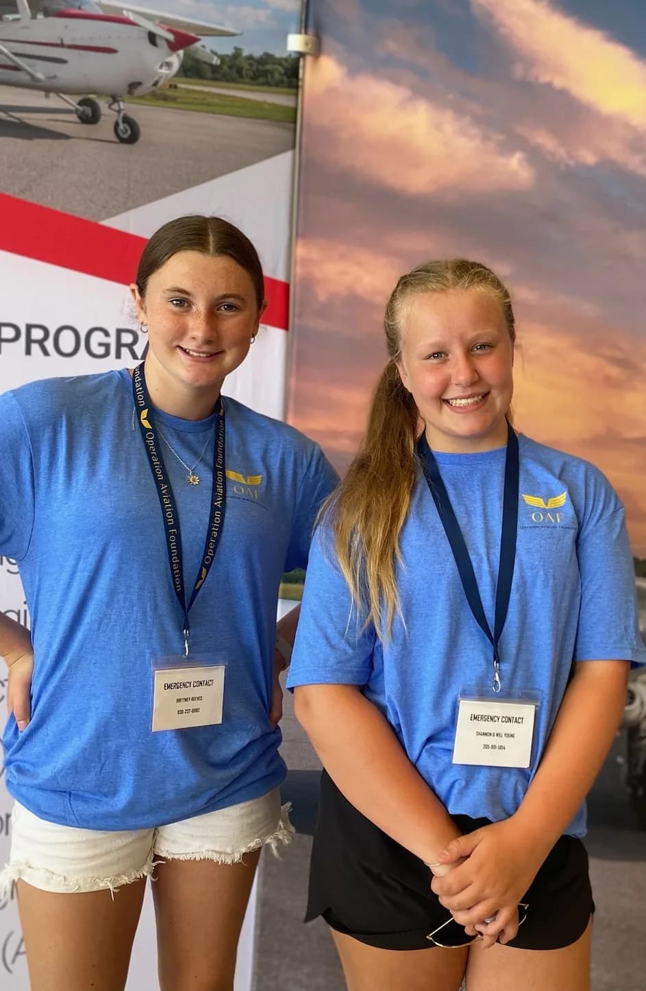 Two OAF ACE campers in their blue shirts at the flight training center